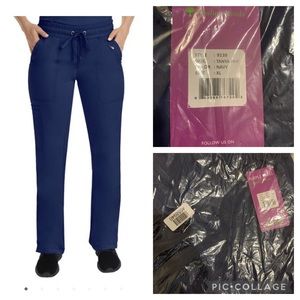 Two XL scrub bottoms new and two 2XL tops